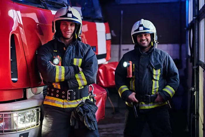 firewatch security guards standing near a red truck ready for any fights