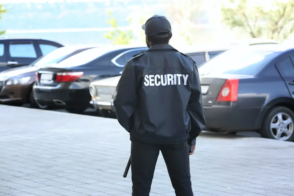 Unarmed security guards in sacramento standing watching customers cars and the parking lot